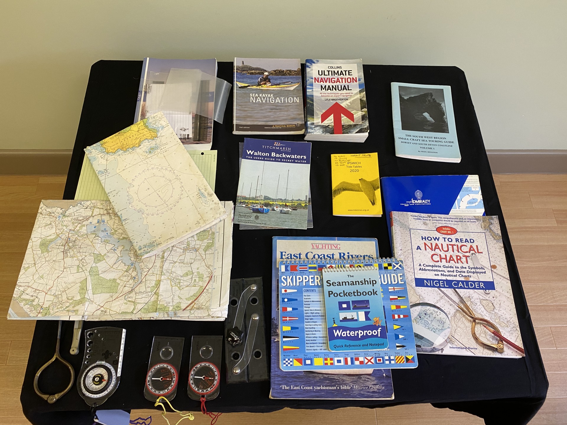 A table of navigation tools, maps and books.