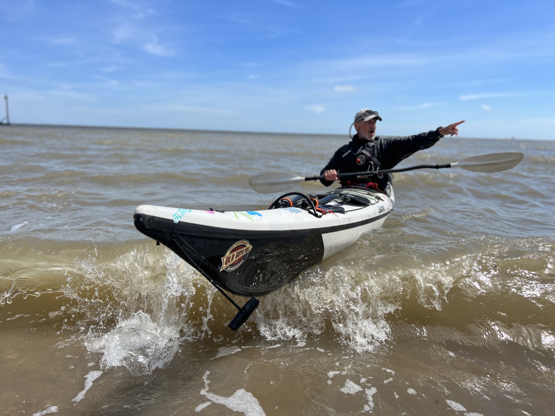 Coach directing students with NOMAD Sea Kayaking.