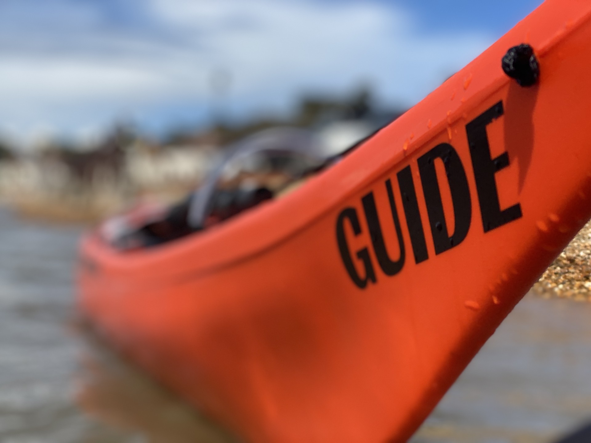 Orange and black Guide sea kayak.