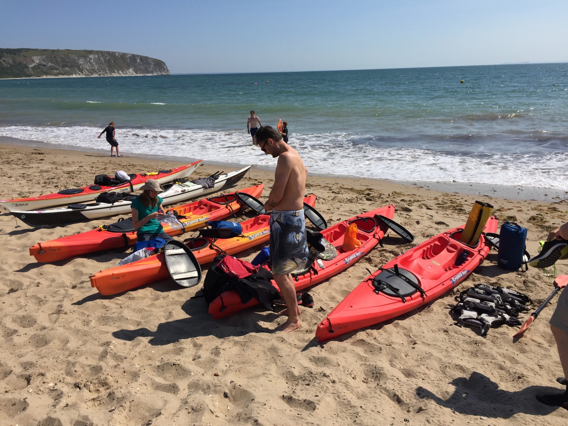 Packing kayaks ready to launch for wild camping & kayaking weekend with NOMAD Sea Kayaking.