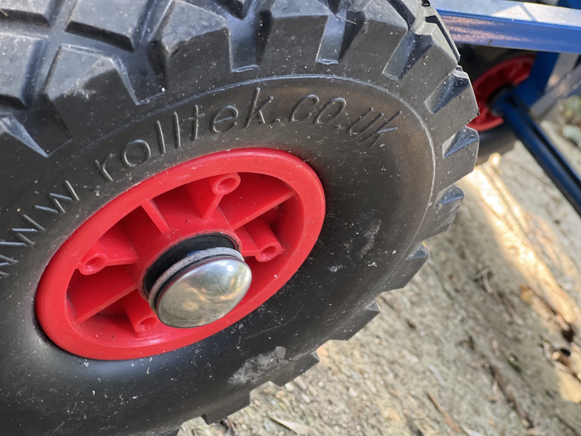 Solid wheels with wheel bearings on heavy duty trolley.