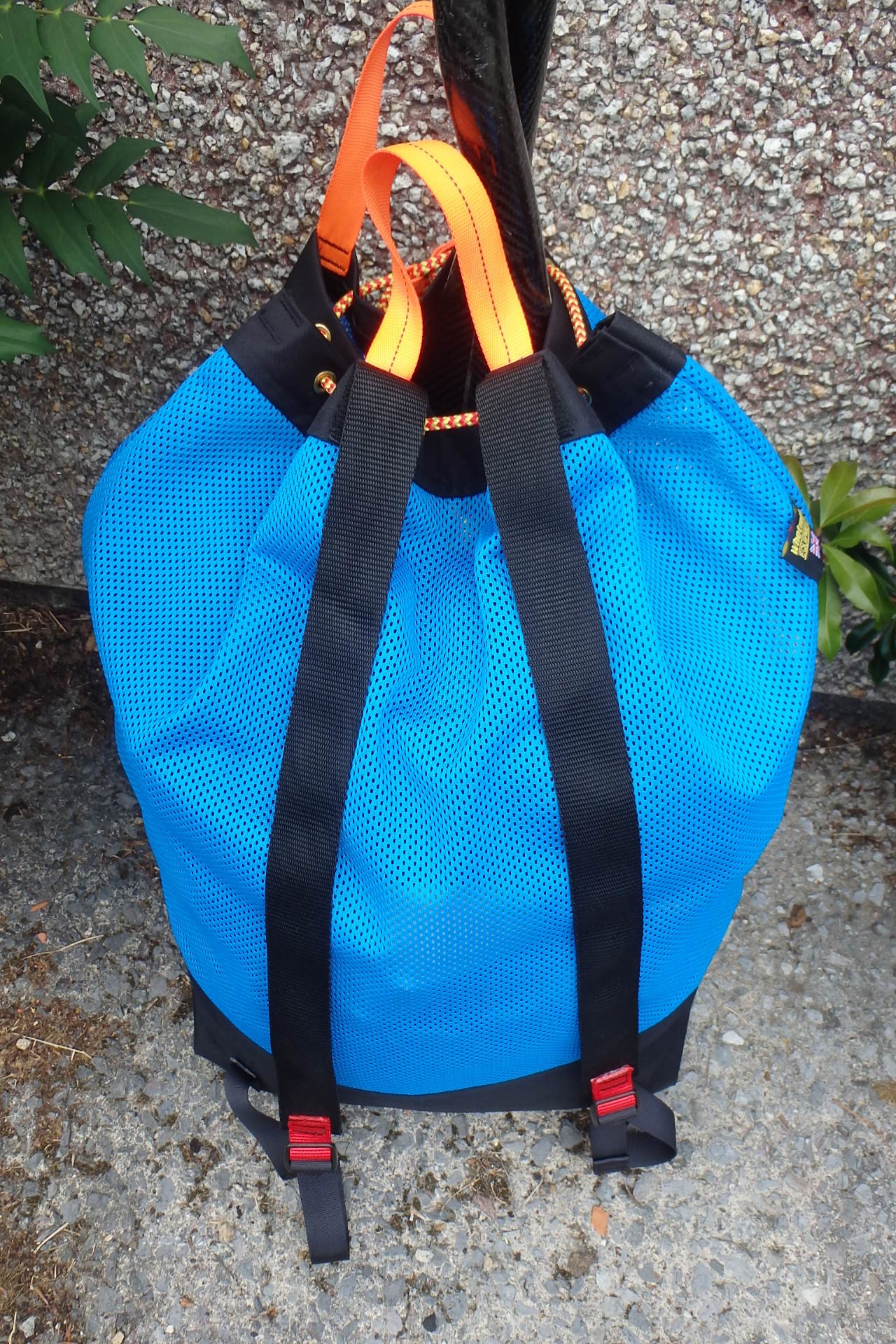 Mesh wet bag with backpack straps from NOMAD Sea Kayaking.