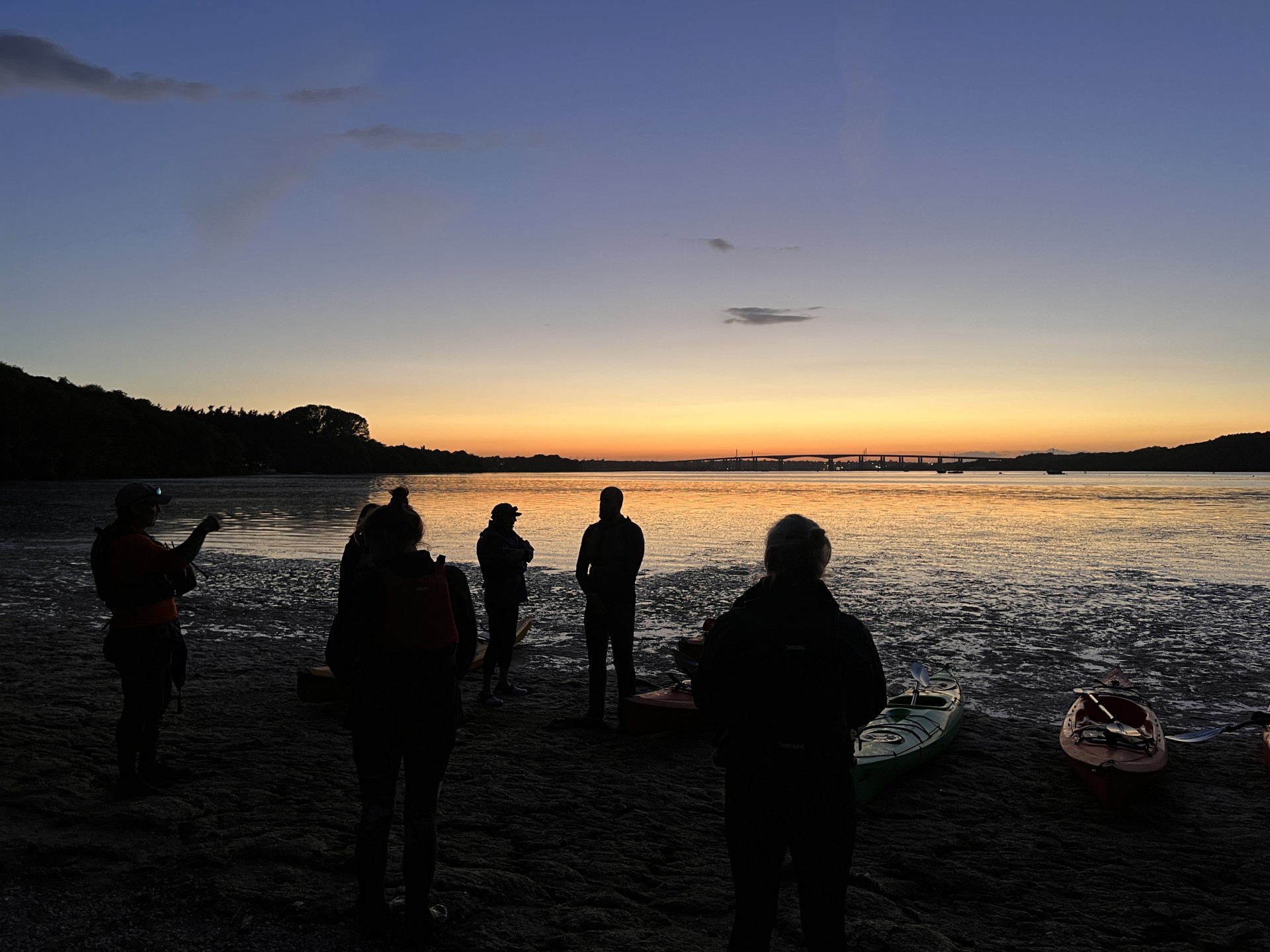 Sunset night paddling with NOMAD Sea Kayaking.