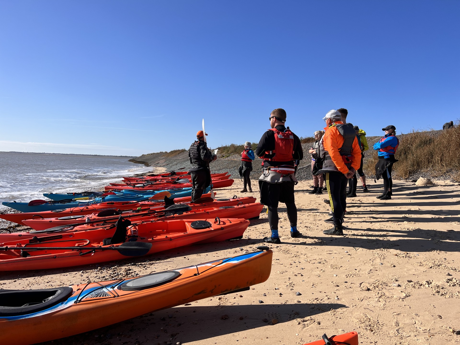 Safety brief on nthye beach with NOMAD Sea Kayaking.