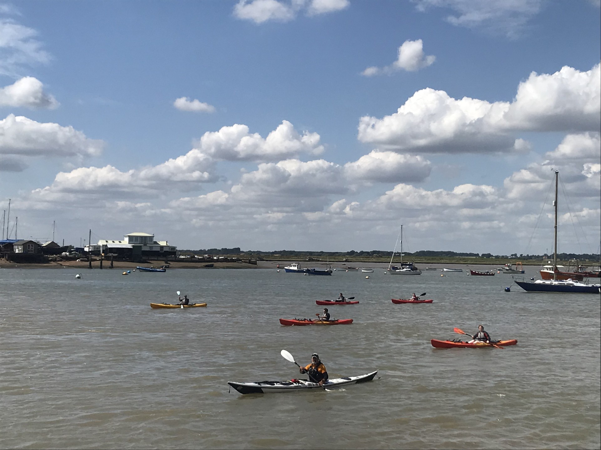 Setting off in sea kayaks with NOMAD Sea Kayaking.