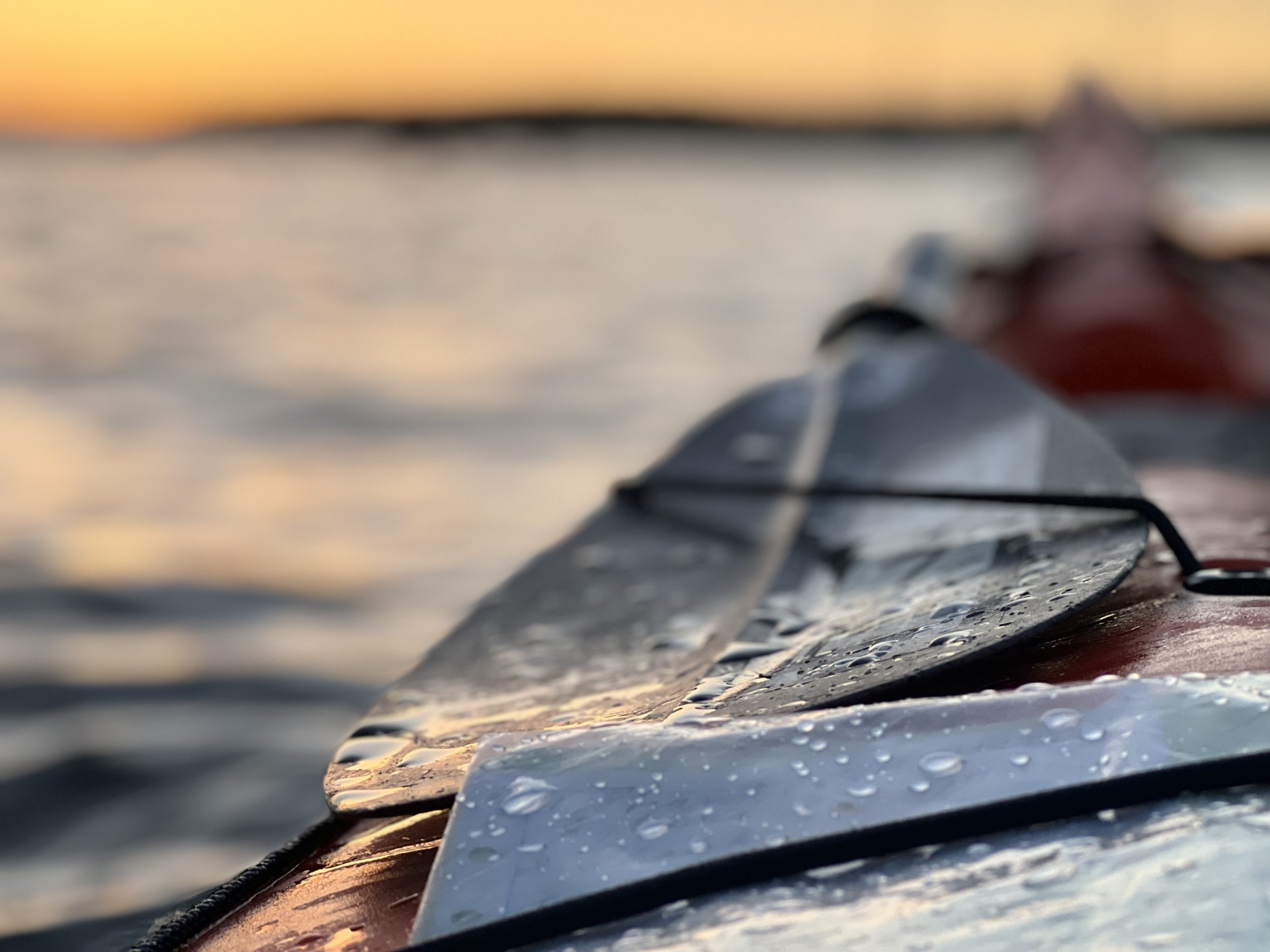 Lendal split paddle on deck of a sea kayak.