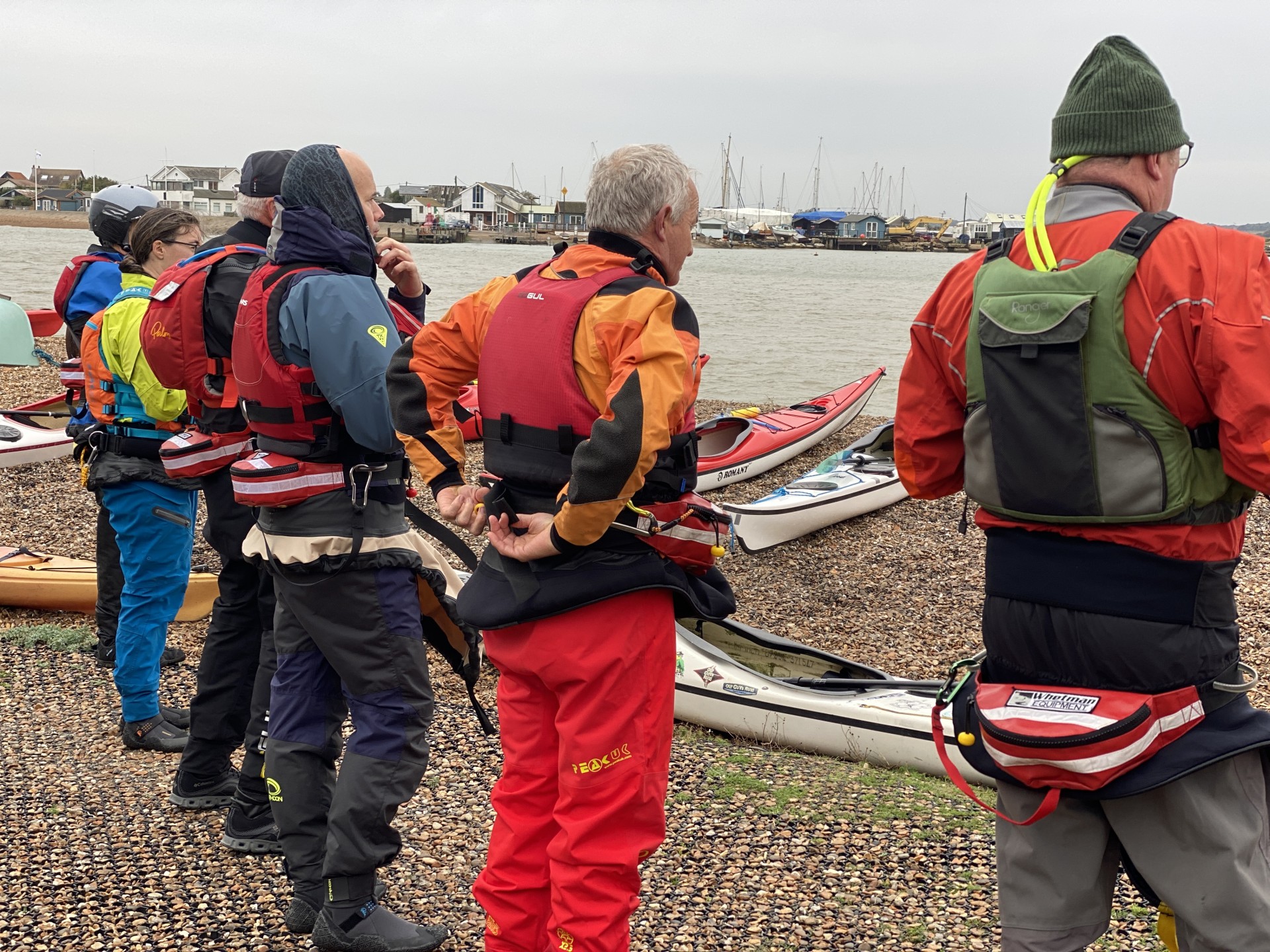 Sea kayakers prepping for their water based session with NOMAD Sea Kayaking.