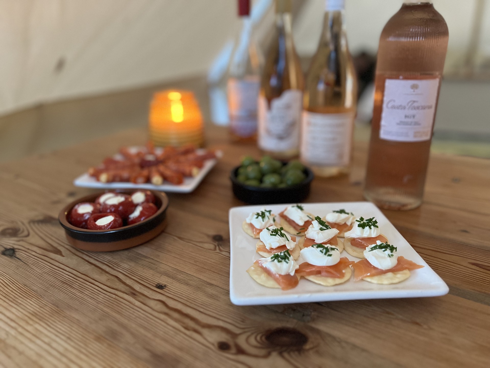 Selection of canapés next to a selection of rosé wines